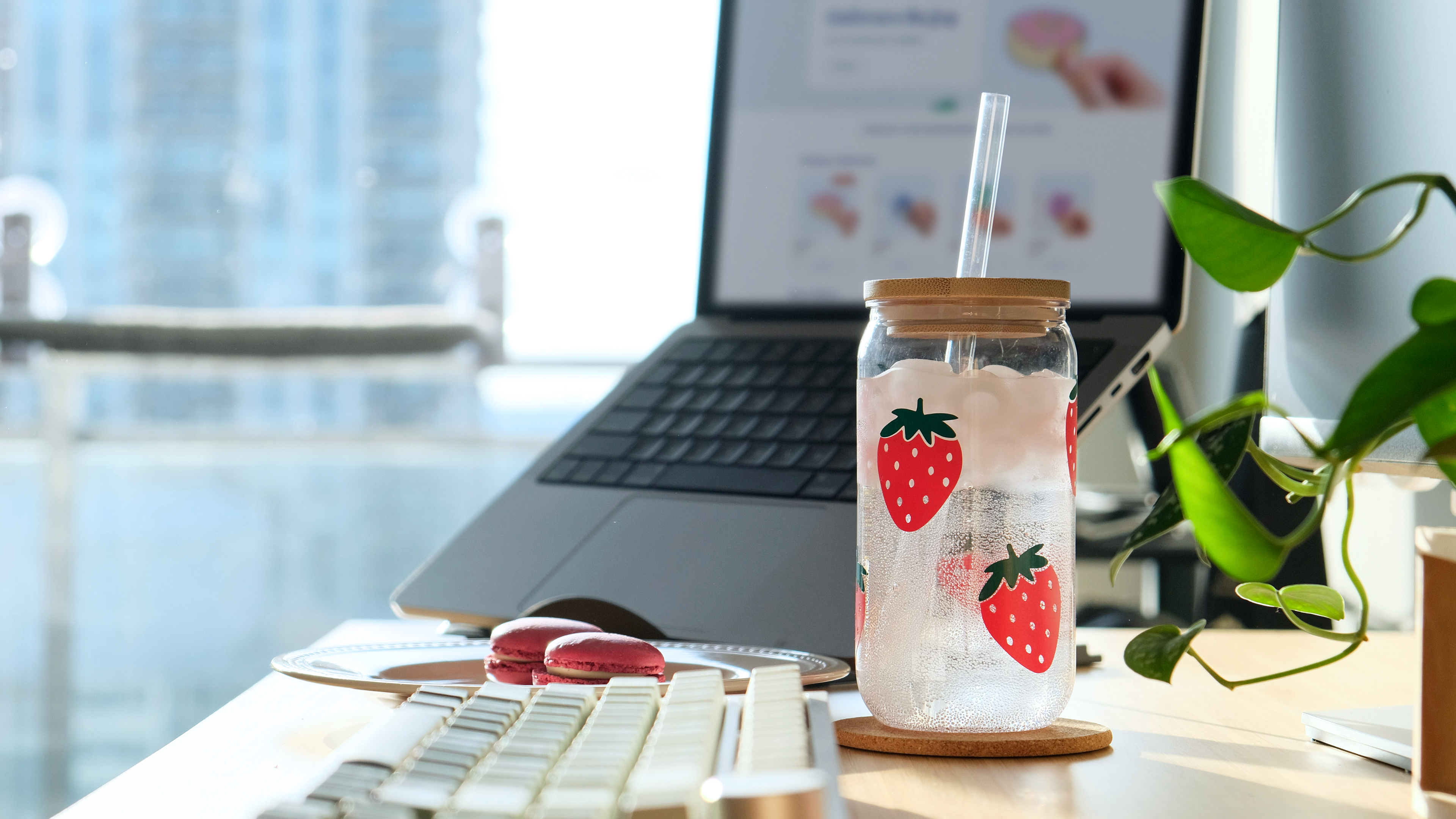 Strawberry tumbler and laptop