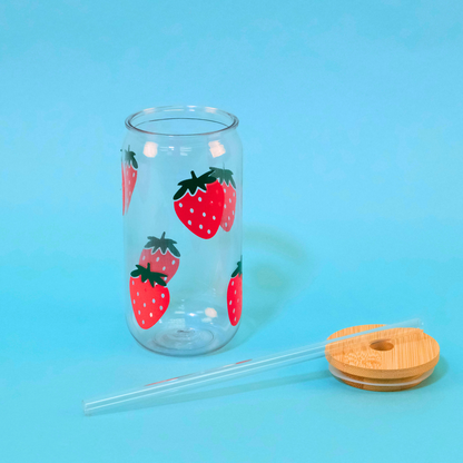Strawberry Tumbler with bamboo lid and plastic straw laying beside