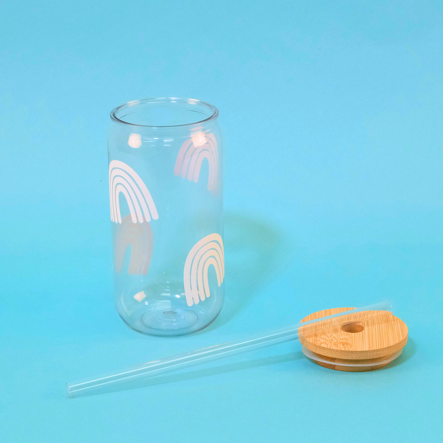 Boho Rainbow Tumbler with Bamboo lid and Plastic Straw laying beside
