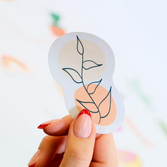 Hand holding a Cute Boho Abstract Plant Sticker – Waterproof vinyl decal with a minimalist botanical design.