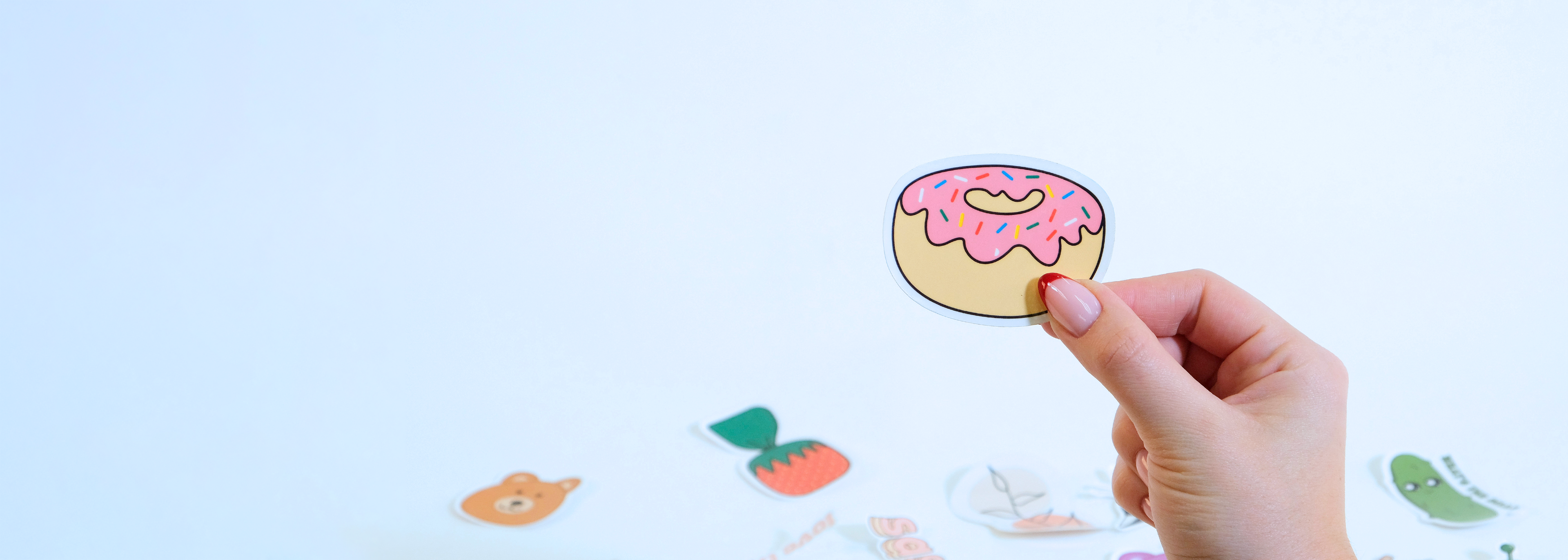 Hand holding Donut Sticker